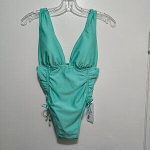 GIGI C Audrey shiny tricot swimsuit with gold accents. Mint. Sz S. NWT
